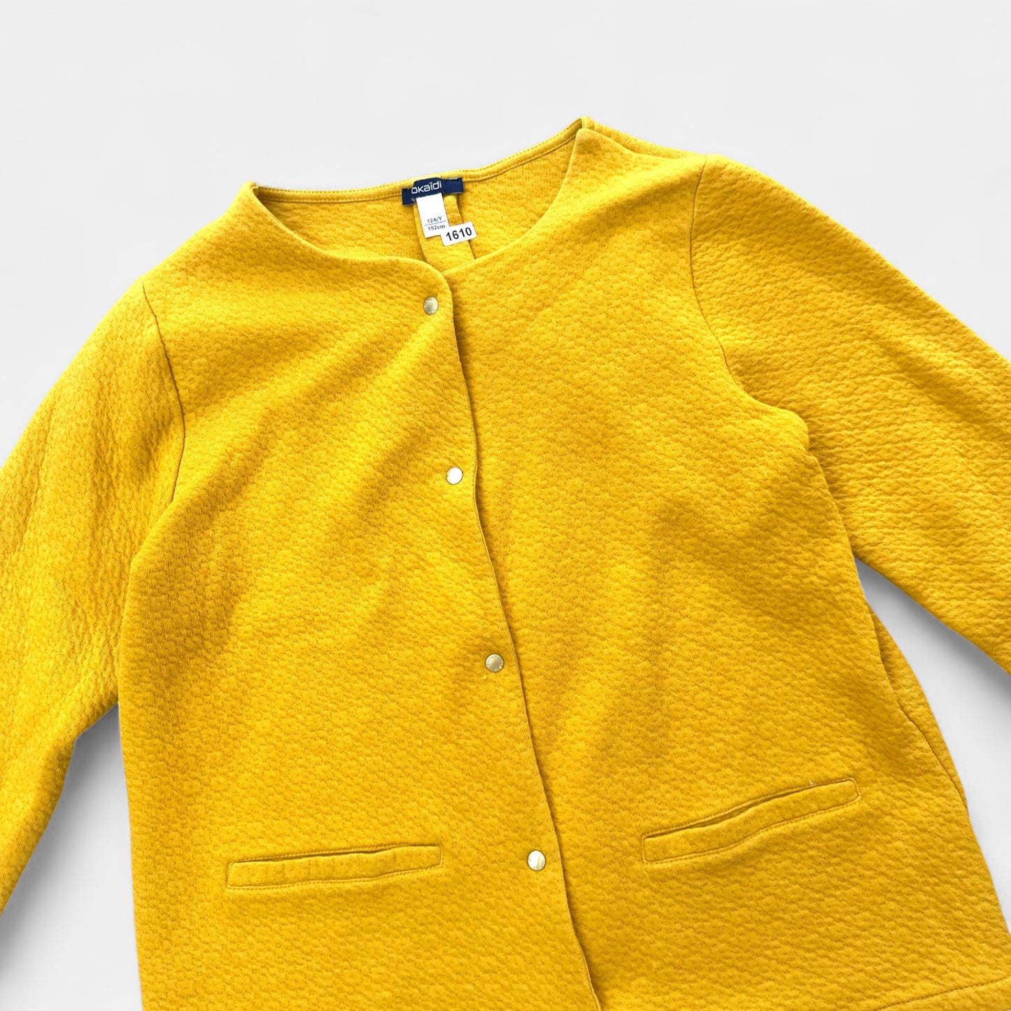 Gilet Okaïdi : 12 ans