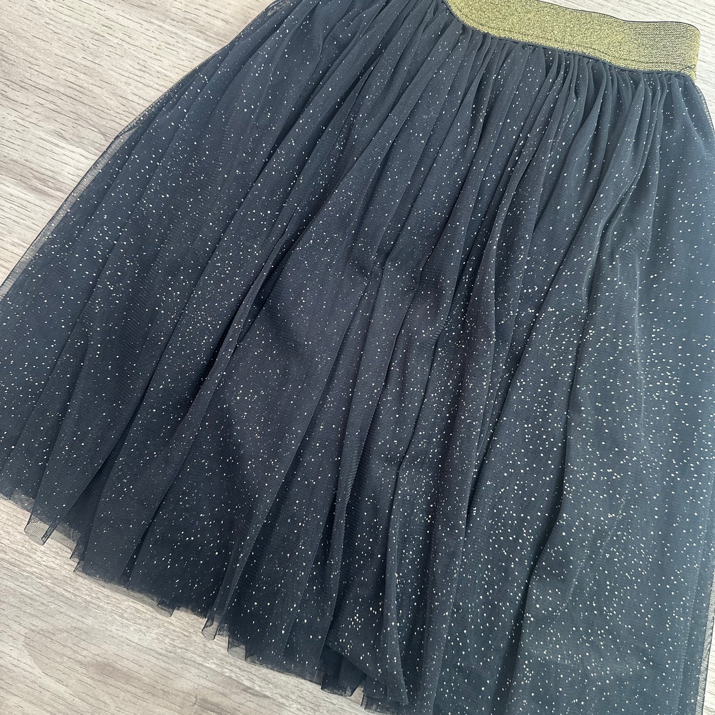 Jupe noir à paillettes dorées : 12 ans