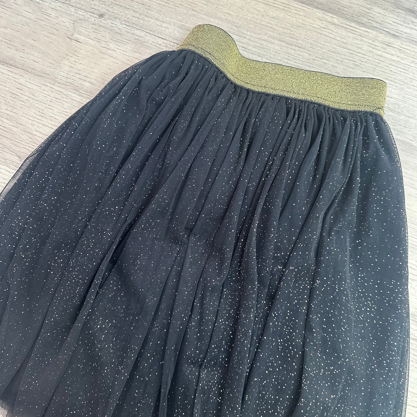 Jupe noir à paillettes dorées : 12 ans